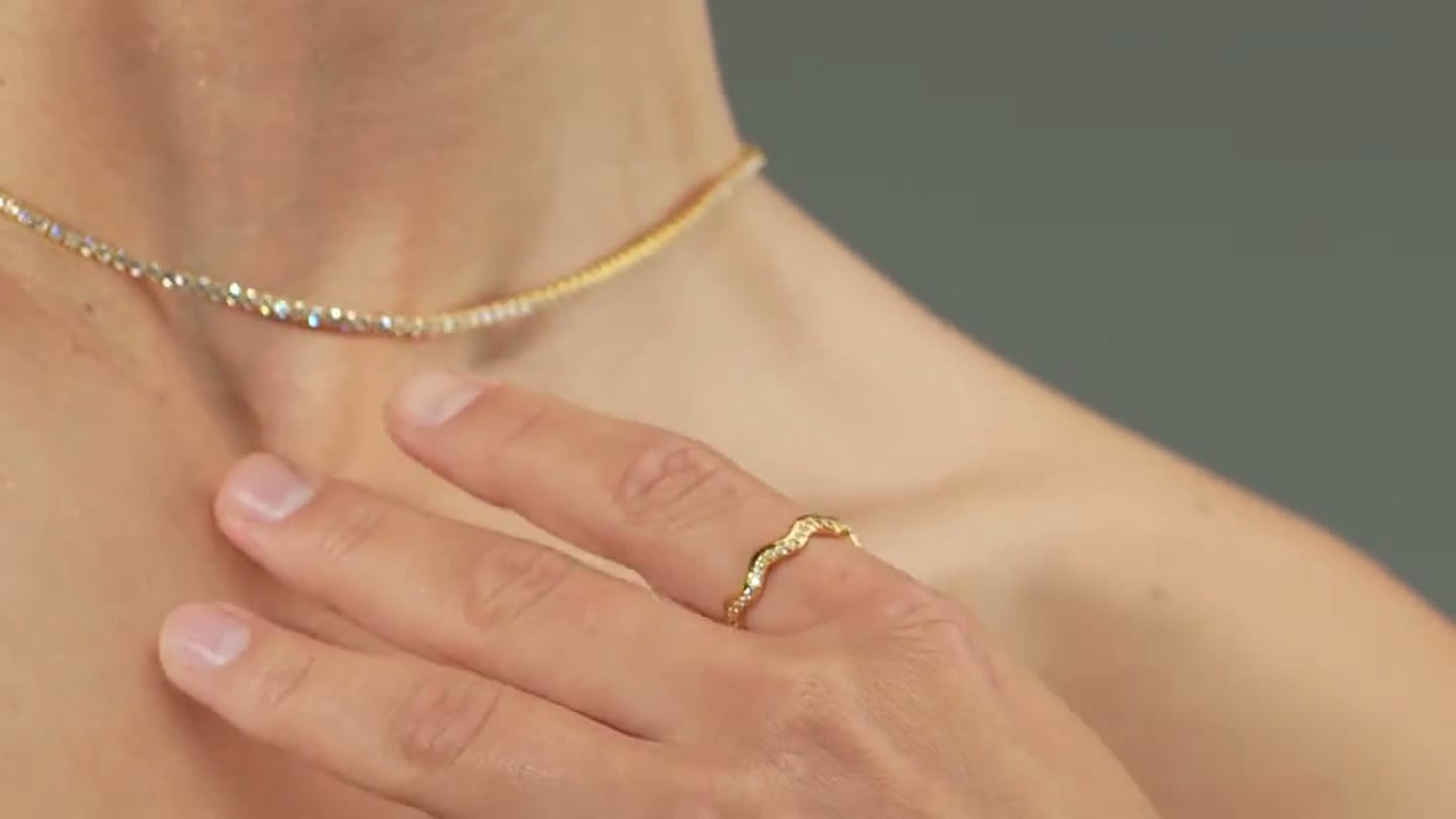 A fine gold chain and a diamond line necklace, worn