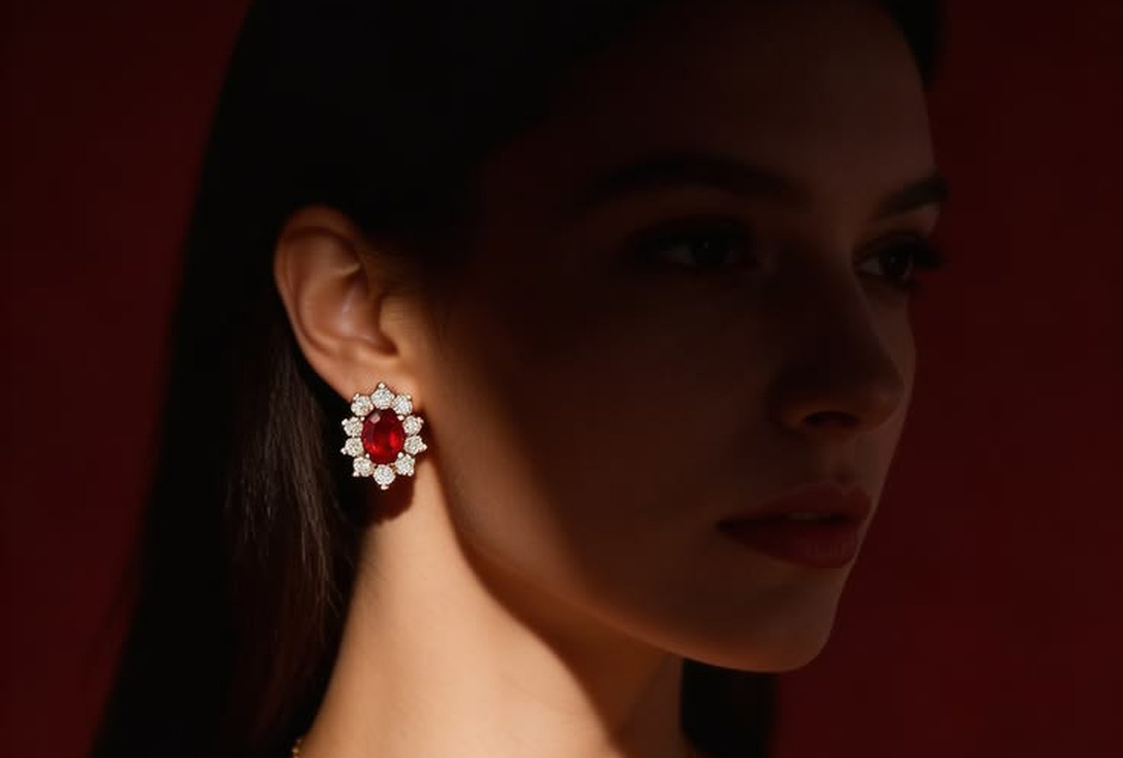 Ruby and diamond cluster earrings with a matching pendant, worn